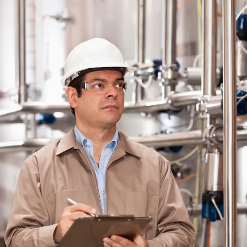 Operator at an industrial plant checking machines
