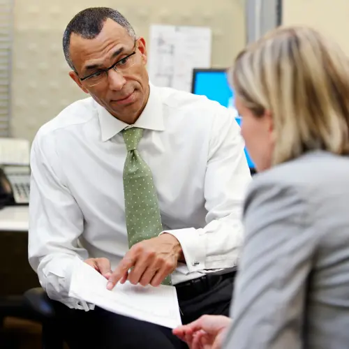 Office workers checking documents consistency